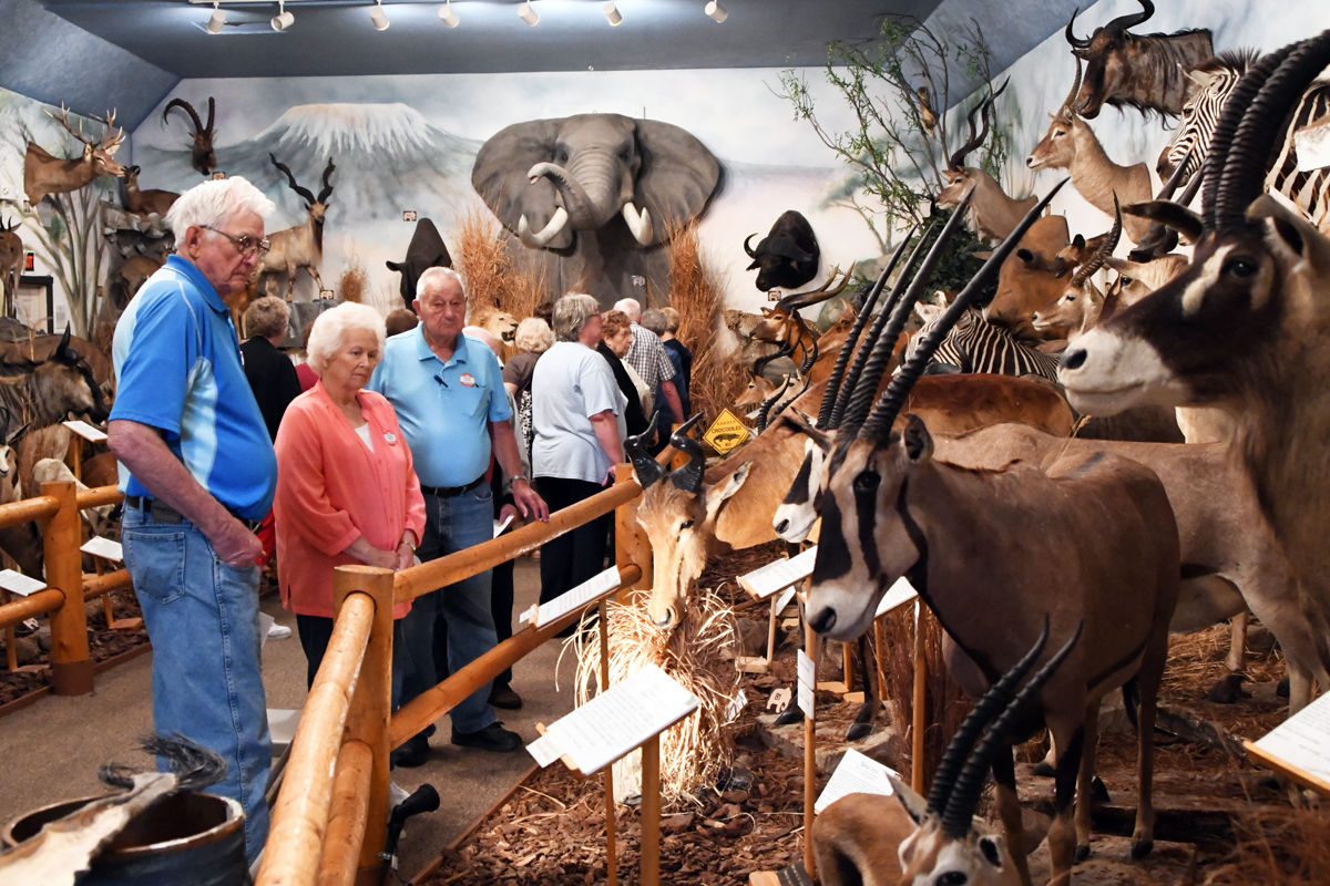 159 Darwin Petersen and Margaret and Wendell Walkup admire the collection.jpg